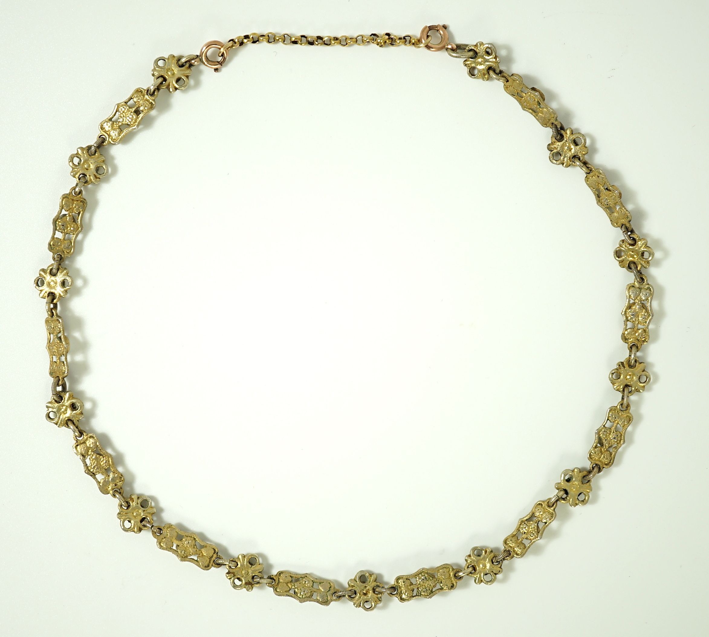 An early 20th century pierced and engraved silver gilt and gem set choker necklace, in the Suffragette colours